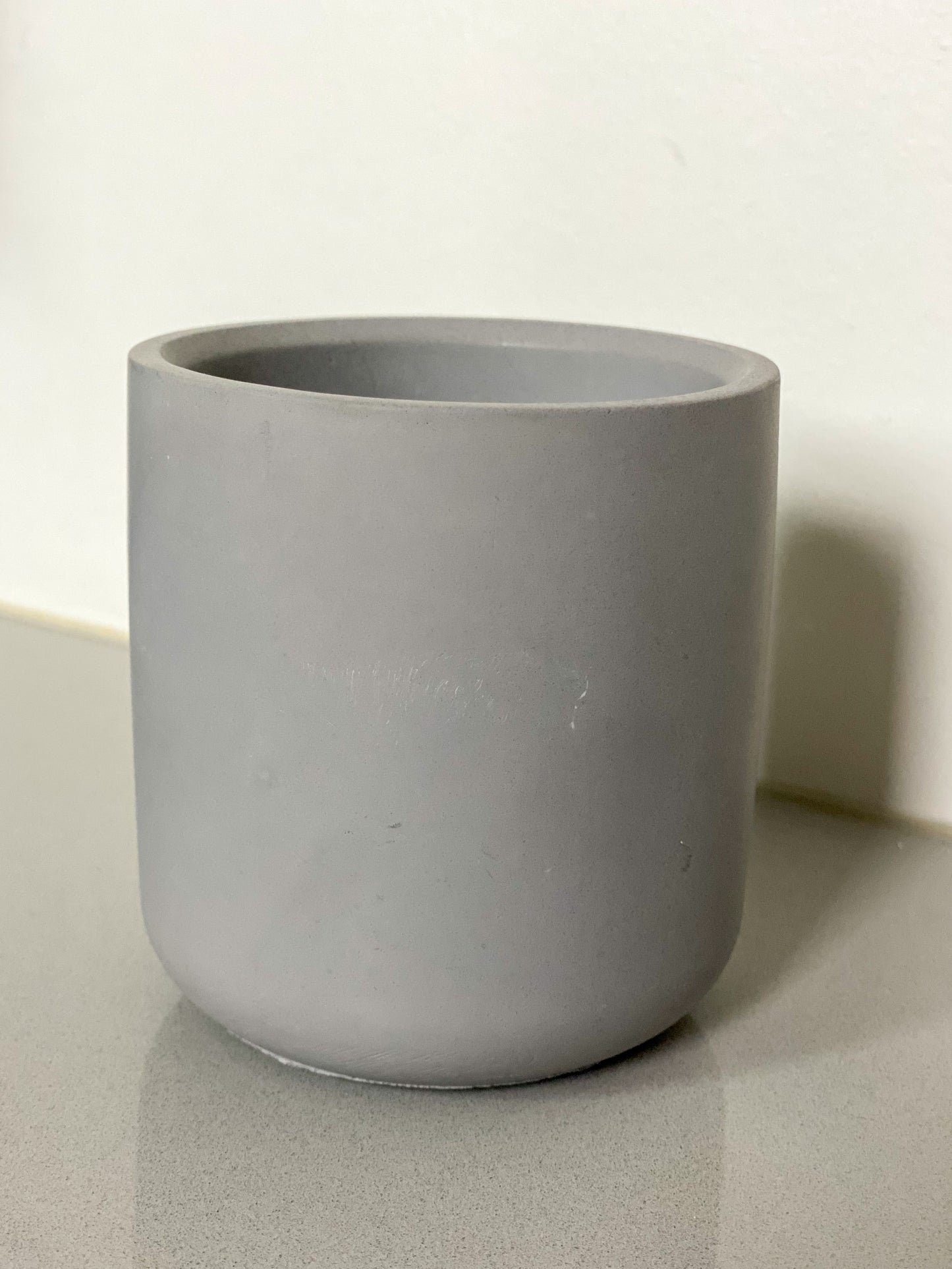 Small handcrafted concrete cylinder pot