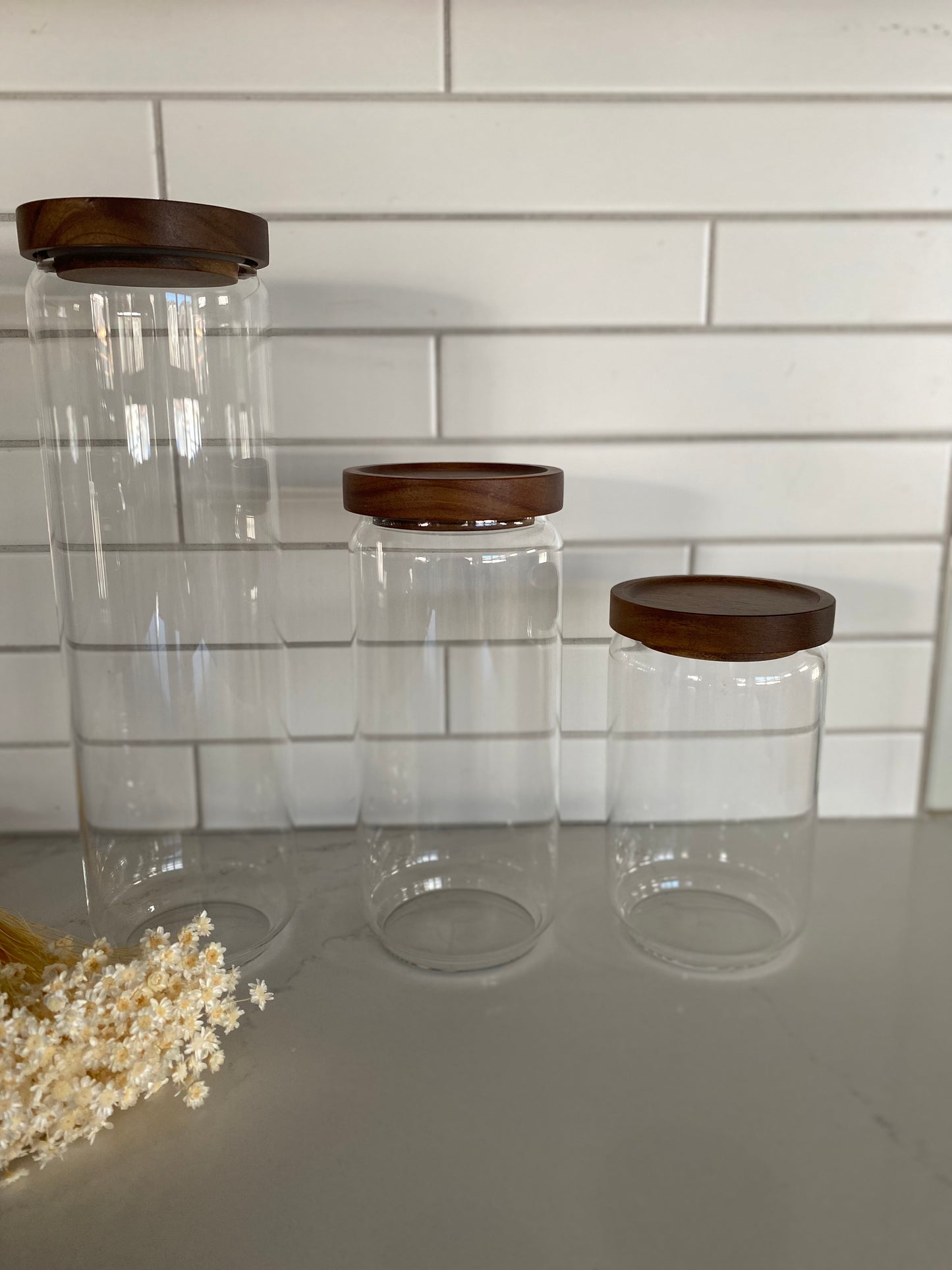 Glass storage canisters with acacia wood lids