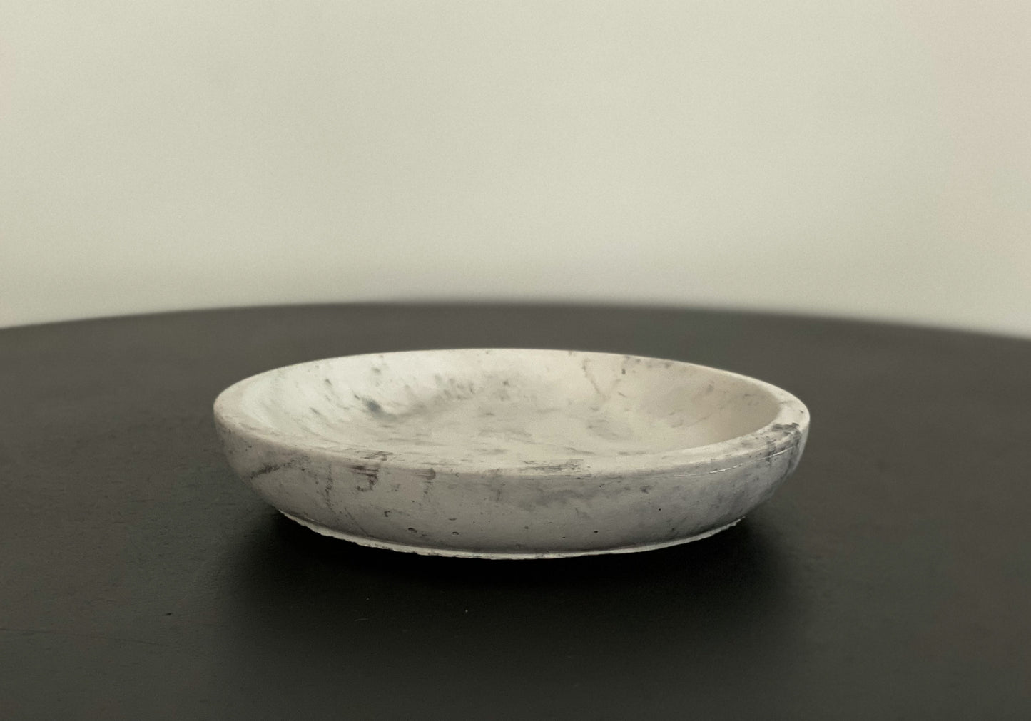 Small round concrete dish