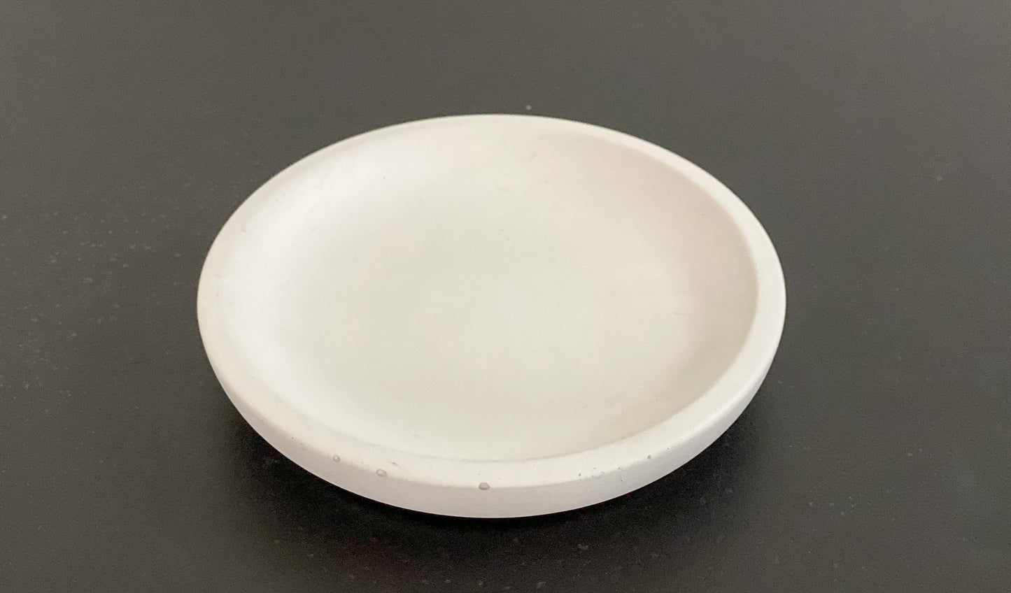 Small round concrete dish